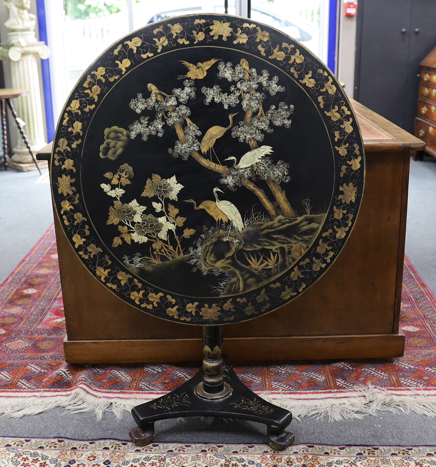 A mid 19th century papier mache circular tilt top table, diameter 83cm, height 78cm